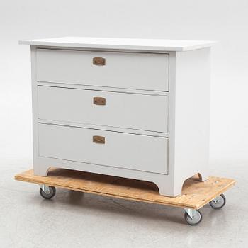 A chest of drawers, circa 1900.