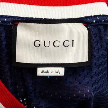GUCCI, a polyester t-shirt and hoodie.