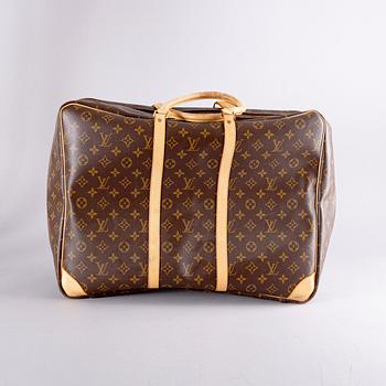 A Louis Vuitton travel bag.