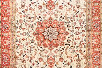 A Tabriz carpet, part silk, 50 raj, c. 304 x 204 cm.