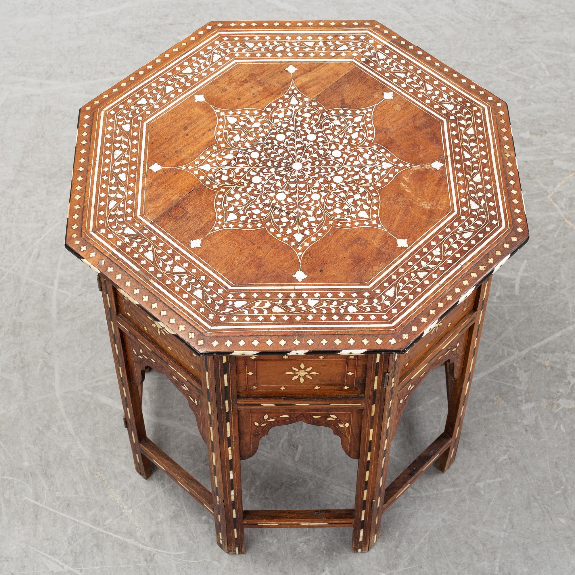A Middle-Eastern occasional table and armchair, 20th Century.
