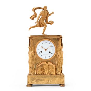 A French Empire gilt bronze mantel clock by M Sirost, master from 1806.