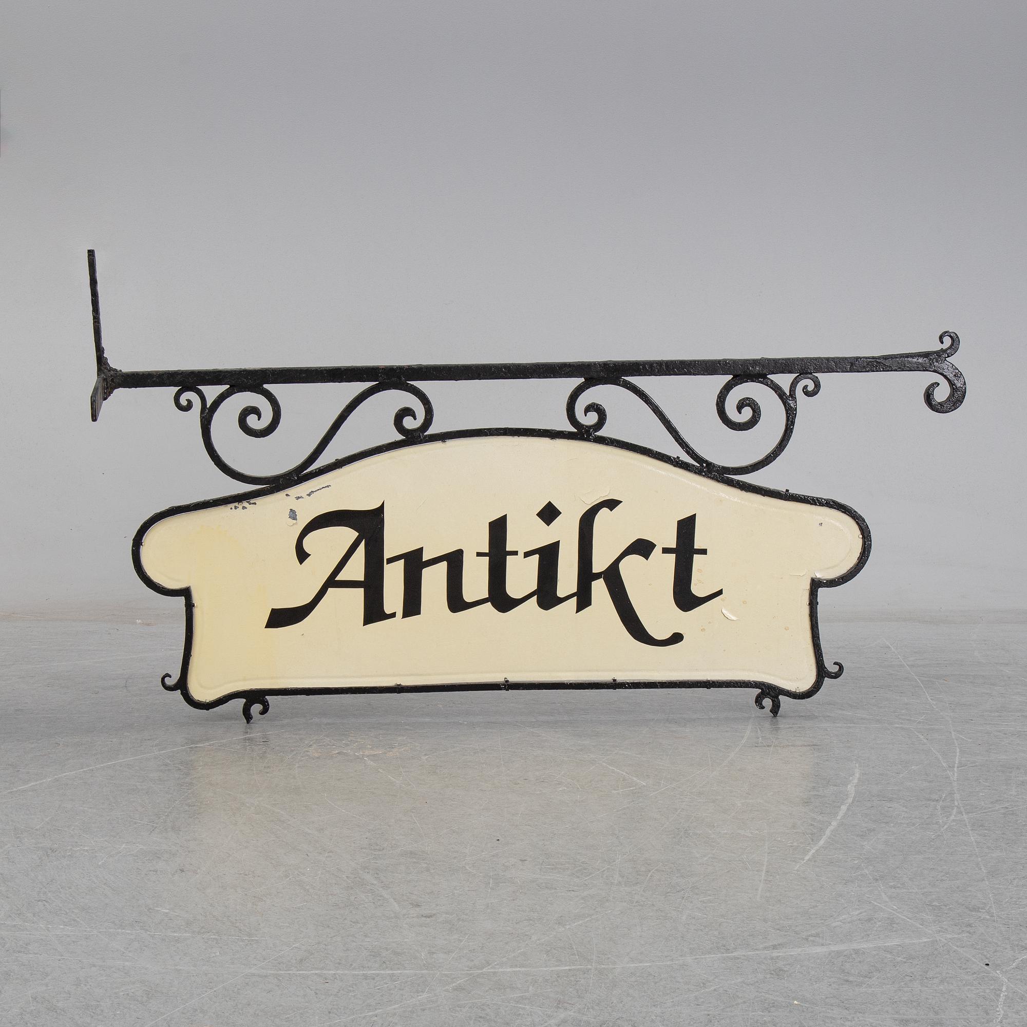 A wrought iron shop sign, 20th Century.