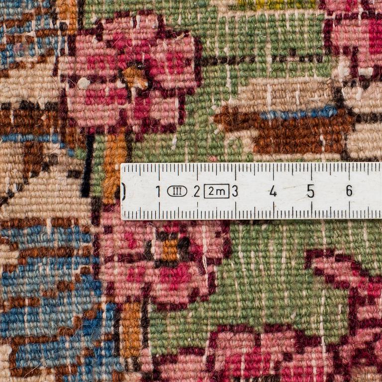 A Kerman carpet, around 360 x 262 cm.