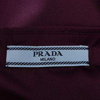 Prada, a burgundy silk blouse, size 36.