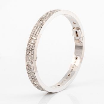 A Cartier "Love" bracelet in 18K white gold set with round brilliant-cut diamonds.