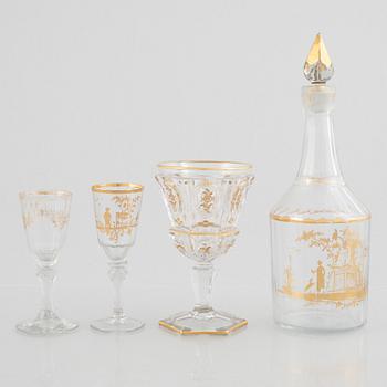 Two sets of wine glasses and a decanter with stopper, later part of the 18th century and later part of the 19th century.