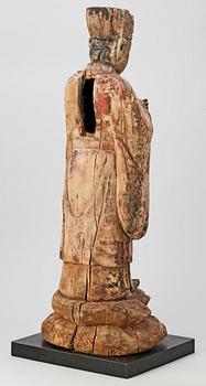 A wooden sculpture of a deity, Ming style.