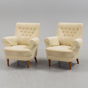 A pair of second half of the 20th century 'Hemmakväll' easy chairs by Carl Malmsten.