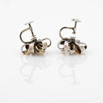 Earrings, a pair, silver and 14k gold with brilliant-cut diamond.