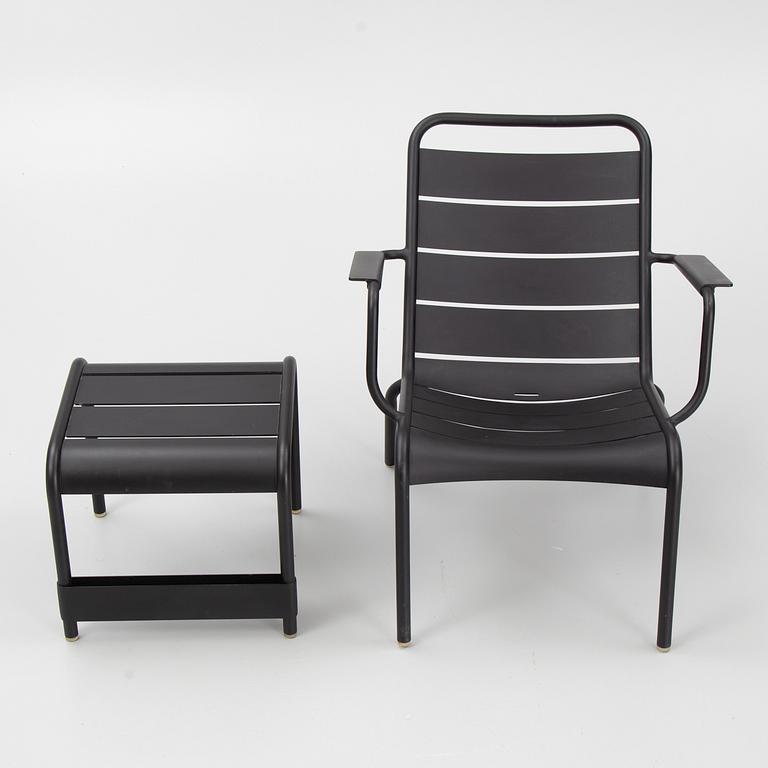 A 'Luxembourg' lounge chair and a foot stool, Fermob.