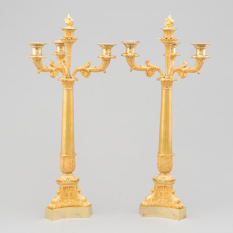 A PAIR OF LATE EMPIRE ORMOLU CANDELABRA, first half of the 19th century.