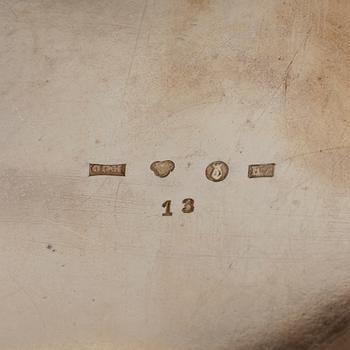 Two silver beakers and a bowl.