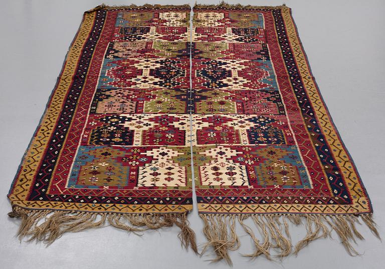 A KILIM, two parts, an antique Reyhanlı, south east Anatolia, ca 290,5 x 79,5 cm and ca 289 x 76 cm.