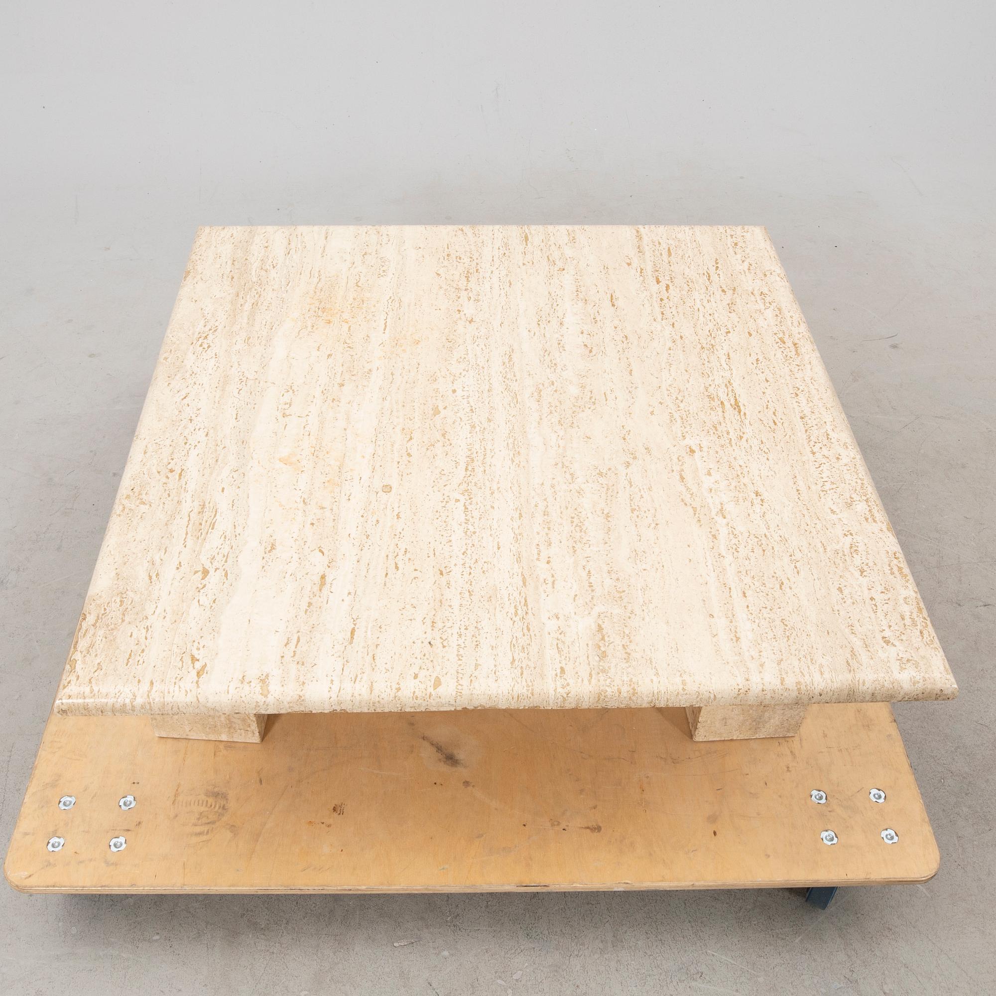 A late 20th century/21st century travertin coffee table.