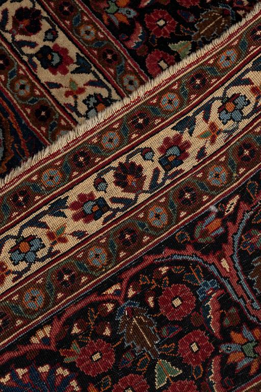 A carpet, semi-antique Mashad/Moud, ca 292 x 214 -218 cm.