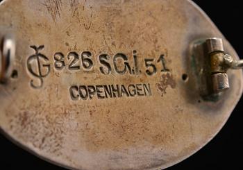 A BROOCH,  826 silver, amber, agath.  Georg Jensen Copenhagen 1904-08. Width 3,8 cm.