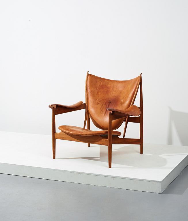 Finn Juhl, a teak and natural brown leather "Chieftain Chair" by Niels Vodder, 1950-60's.