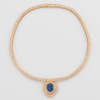 An 18K gold necklace set with a faceted sapphire ca 8.00 cts and round brilliant-cut diamonds.