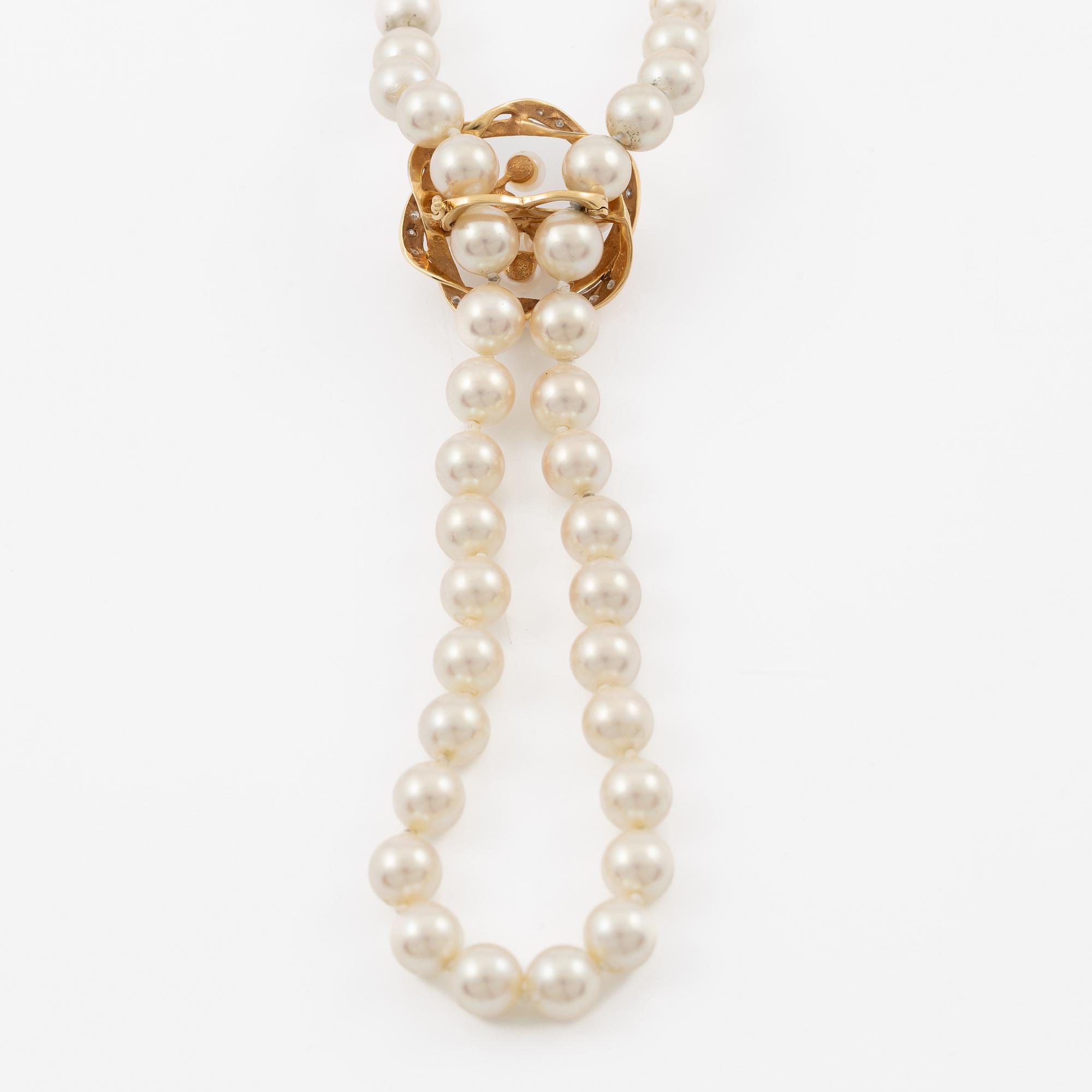 Necklace with imitation pearls, clasp 18K gold with amethyst, spacers 18K gold with pearls and diamonds.