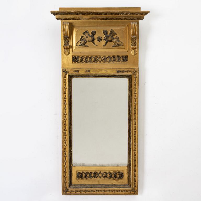 an Empire mirror, Sweden, early 19th century.
