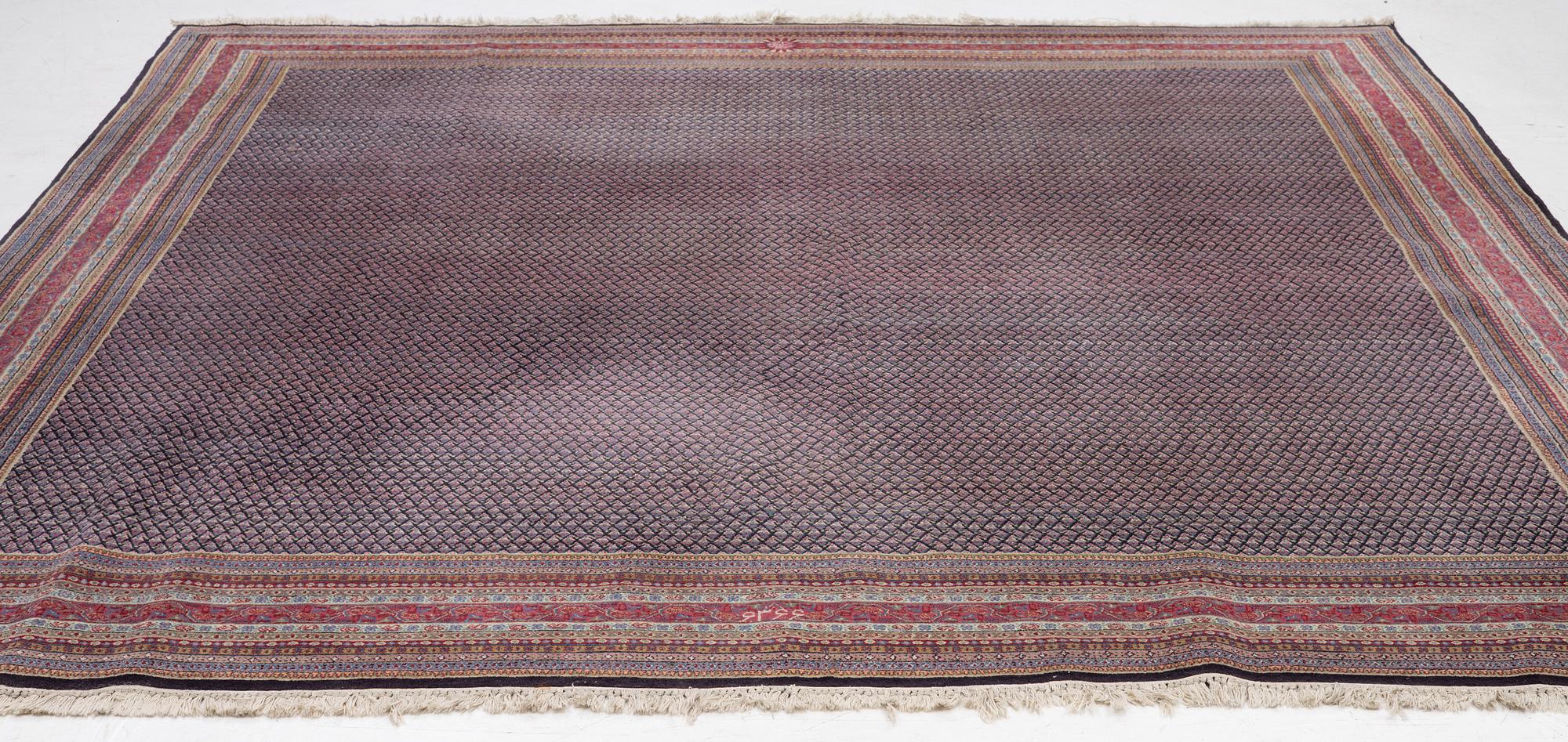 A oriental carpet, signed, c. 295 x 295 cm.