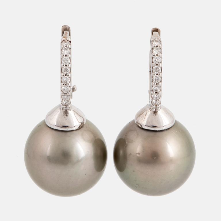 Cultured Tahiti pearl and diamond earrings.