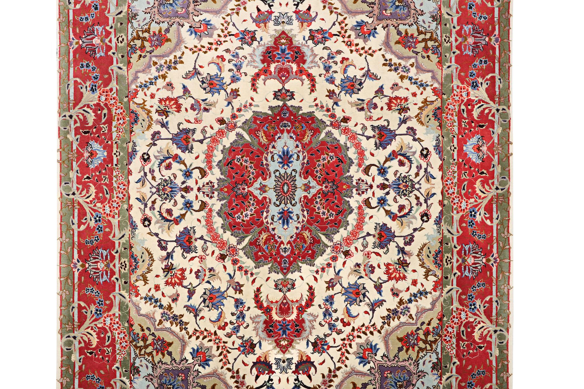 A Tabriz rug, part silk, 50 raj, c. 204 x 154 cm.