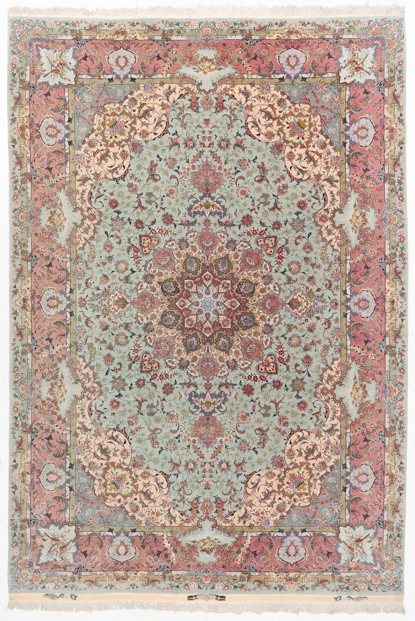 A Tabriz carpet, part silk, approx. 367 x 250 cm.