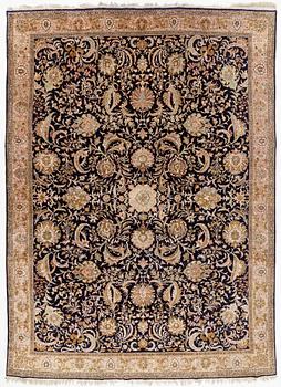 A semi-antique silk Qum carpet, c. 404 x 292 cm.