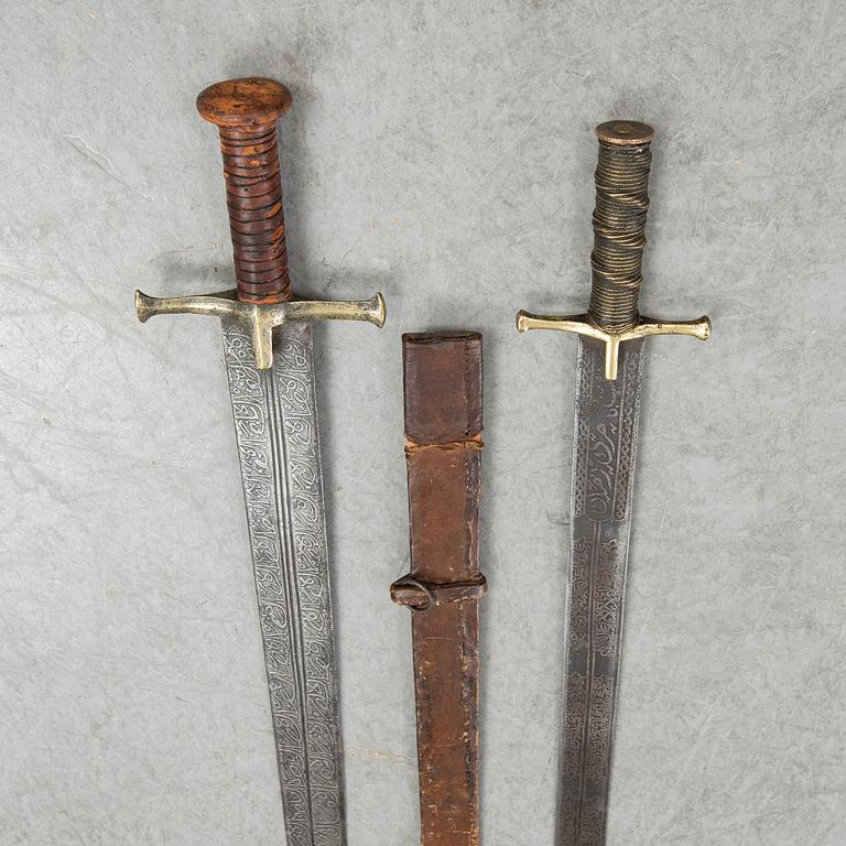 Two East African Kaskara swords- One with scabbard. 19-20th Century.