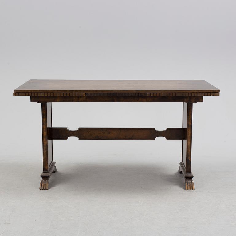 A 1920´s dinner table and six chairs probably designed by Axel Einar Hjorth for AB Svenska möbelfabriken Bodafors.