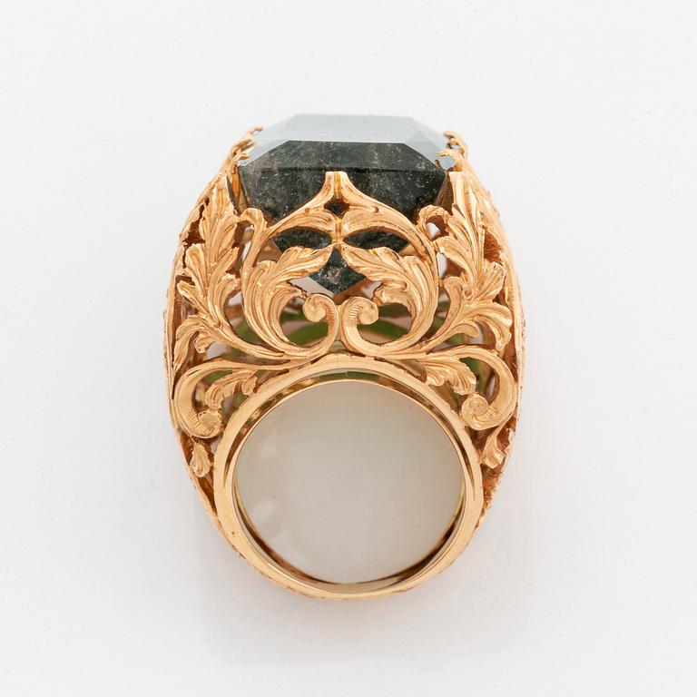 A Tina Karlsson ring in 18K gold set with a large step-cut tourmaline.