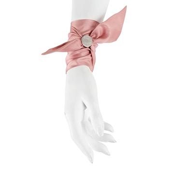 303. HERMÈS, three silk braclets with palladiumcovered locks.