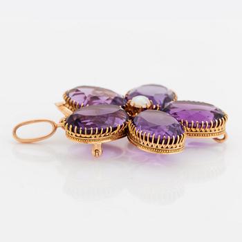 An 18K gold brooch/pendant set with faceted amethysts and a pearl.