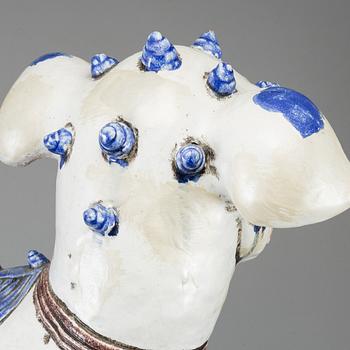 A large Chinese ceramic tile sculpture of a buddhist lion, 20th century.