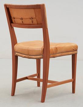 A Josef Frank mahogany and leather chair, model 695, upholstered by Jonny Johansson, Acne for Svenskt Tenn 2009.