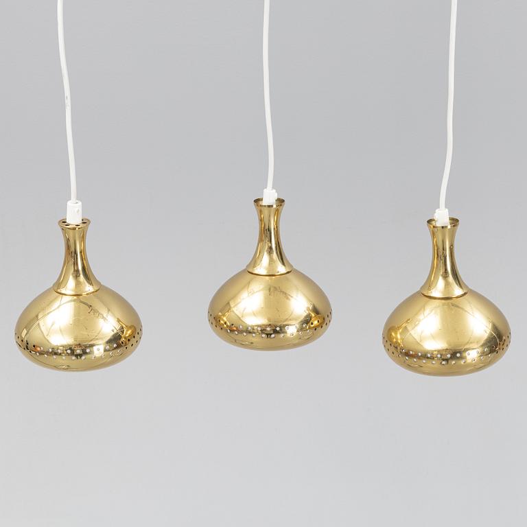 A set of three brass pendule lights, second half of the 20th Century.
