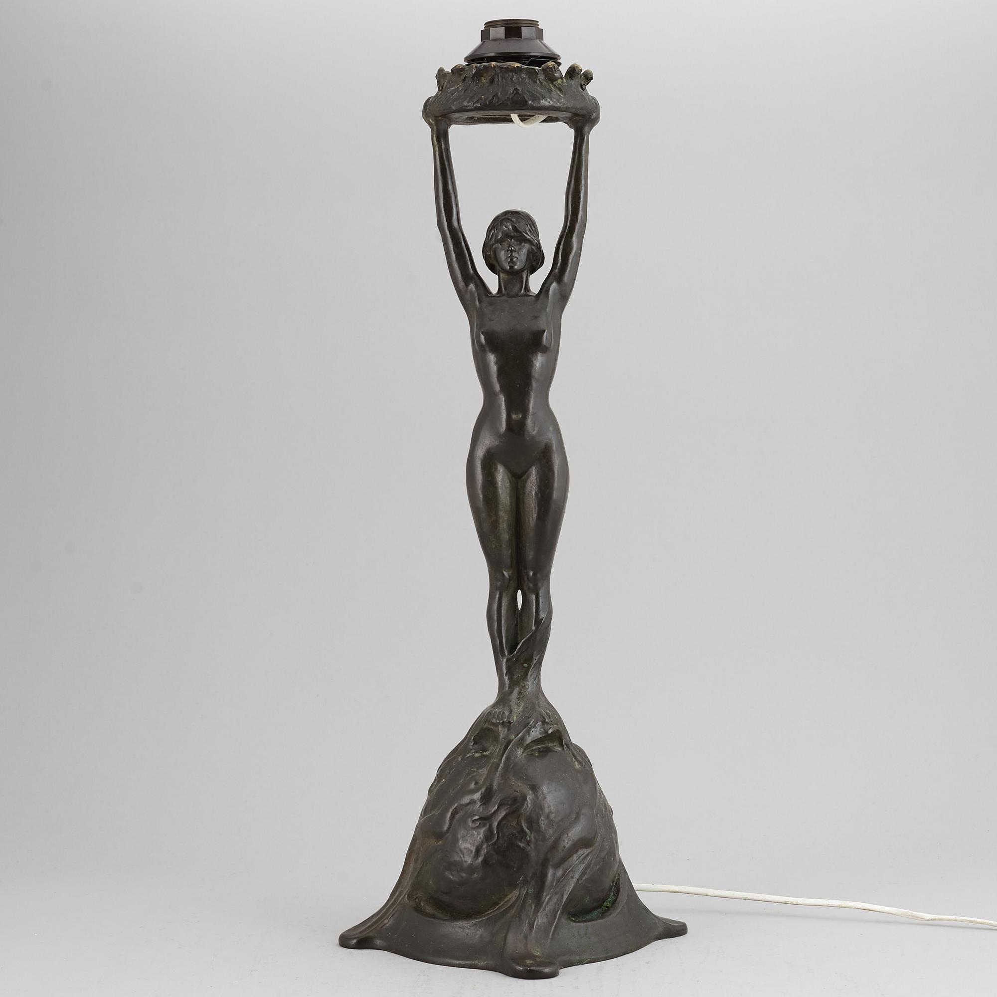 GERDA SPRINCHORN, an Art Nouveau green patinated bronze lamp "The Sun", Herman Bergman, Stockholm, early 20th century.