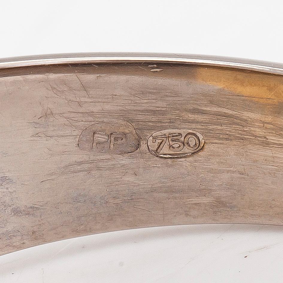 Klackring, 18K vit-/gultguld, briljantslipade diamanter tot. ca 0.06 ct.