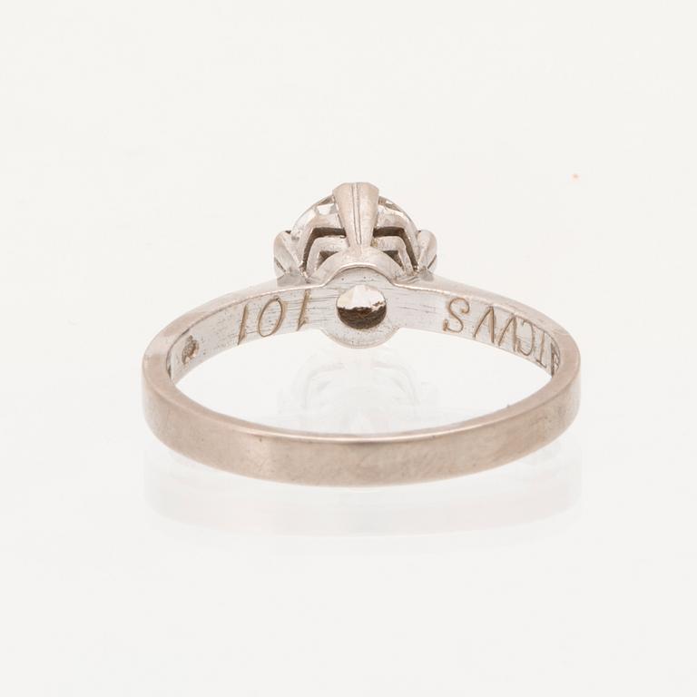 An 18K white gold solitaire ring set with a round brilliant cut diamond.