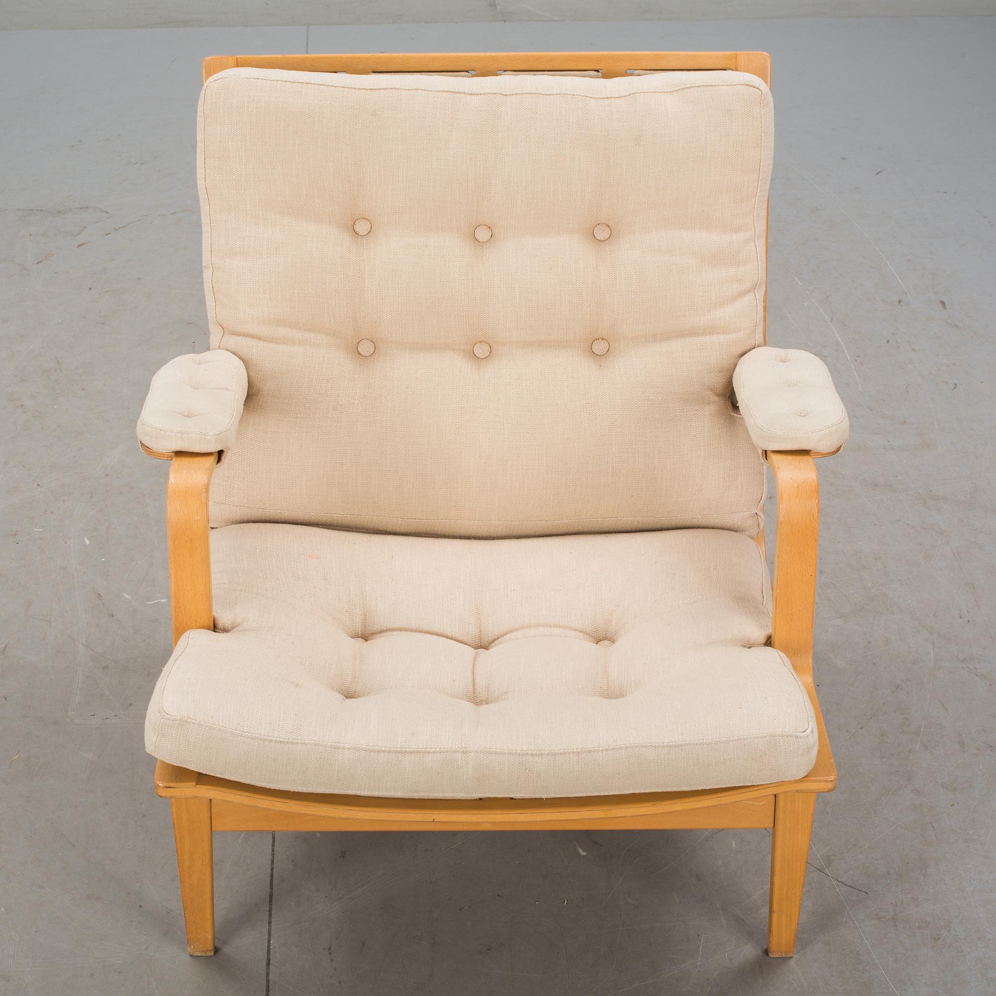 FÅTÖLJ. "Ingrid", Bruno Mathsson för DUX, 1900-talets andra hälft.