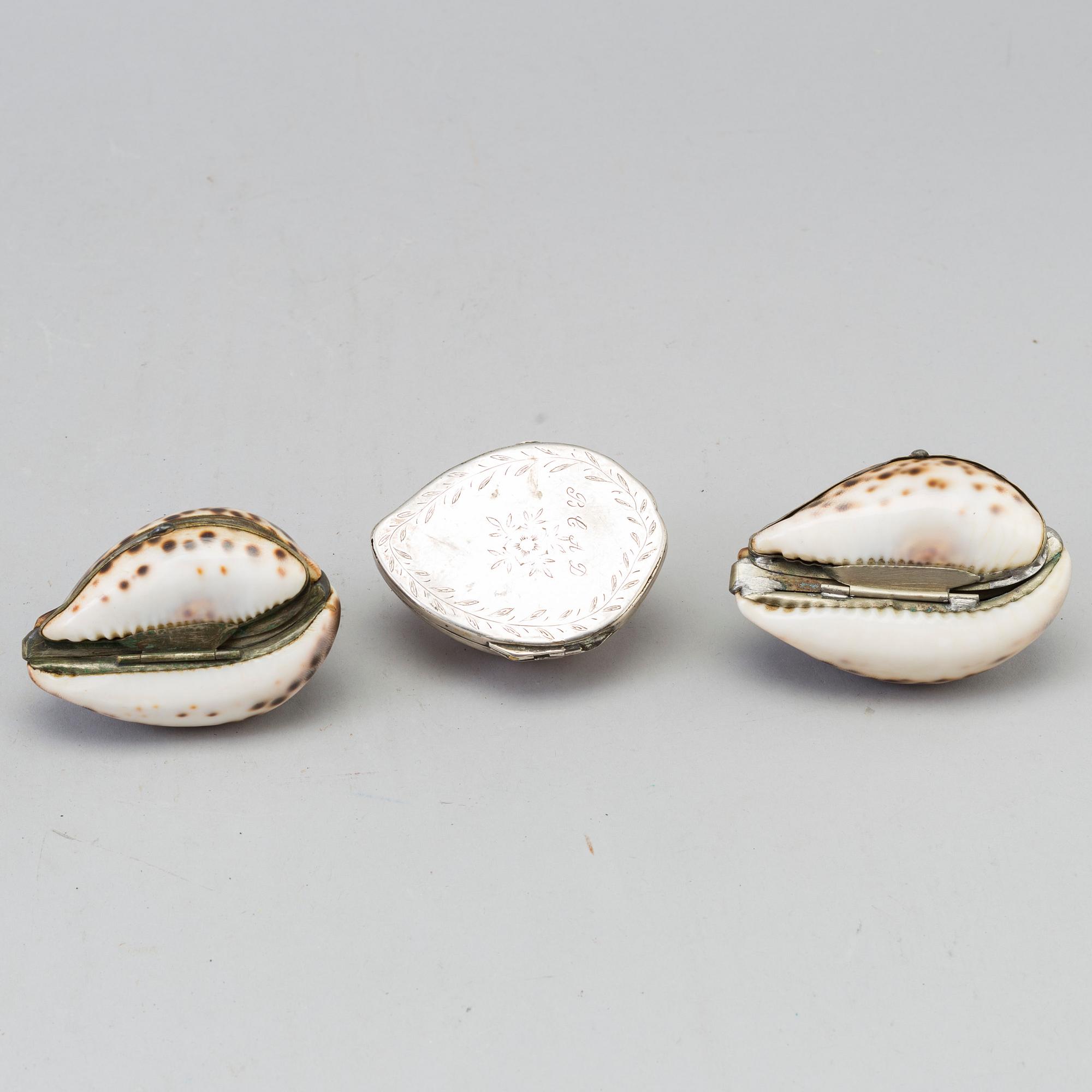 THREE COWRIE SHELL SNUFF BOXES, 19th century.