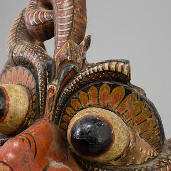 A large wooden dance mask, South-East Asia, early 20th Century.