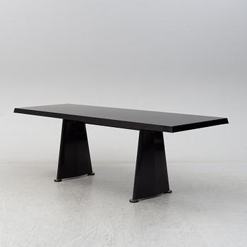 A 'Trapeze' dinner table by Jean Prouvé, Vitra, 2002.