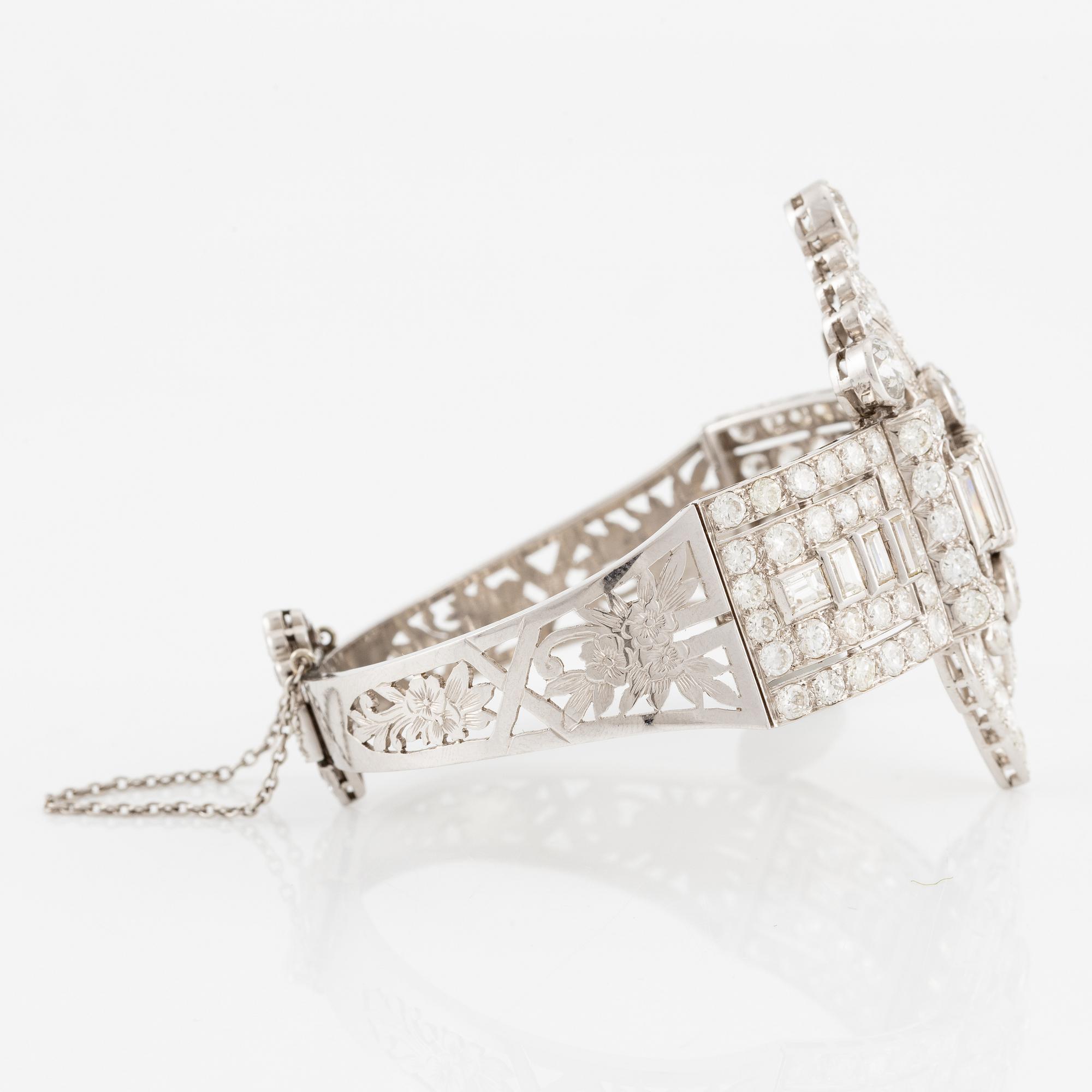 A bracelet in platinum set with baguette and brilliant-cut diamonds, Art Déco.
