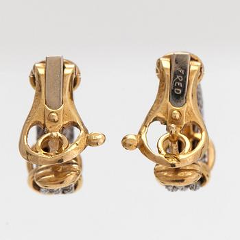 A pair of 'Force 10' earrings, 18K gold and steel. Fred, Paris 1980's.