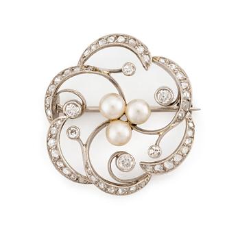 523. A W.A. Bolin brooch in 18K white gold set with round brilliant-, eight- and rose-cut diamonds and pearls.