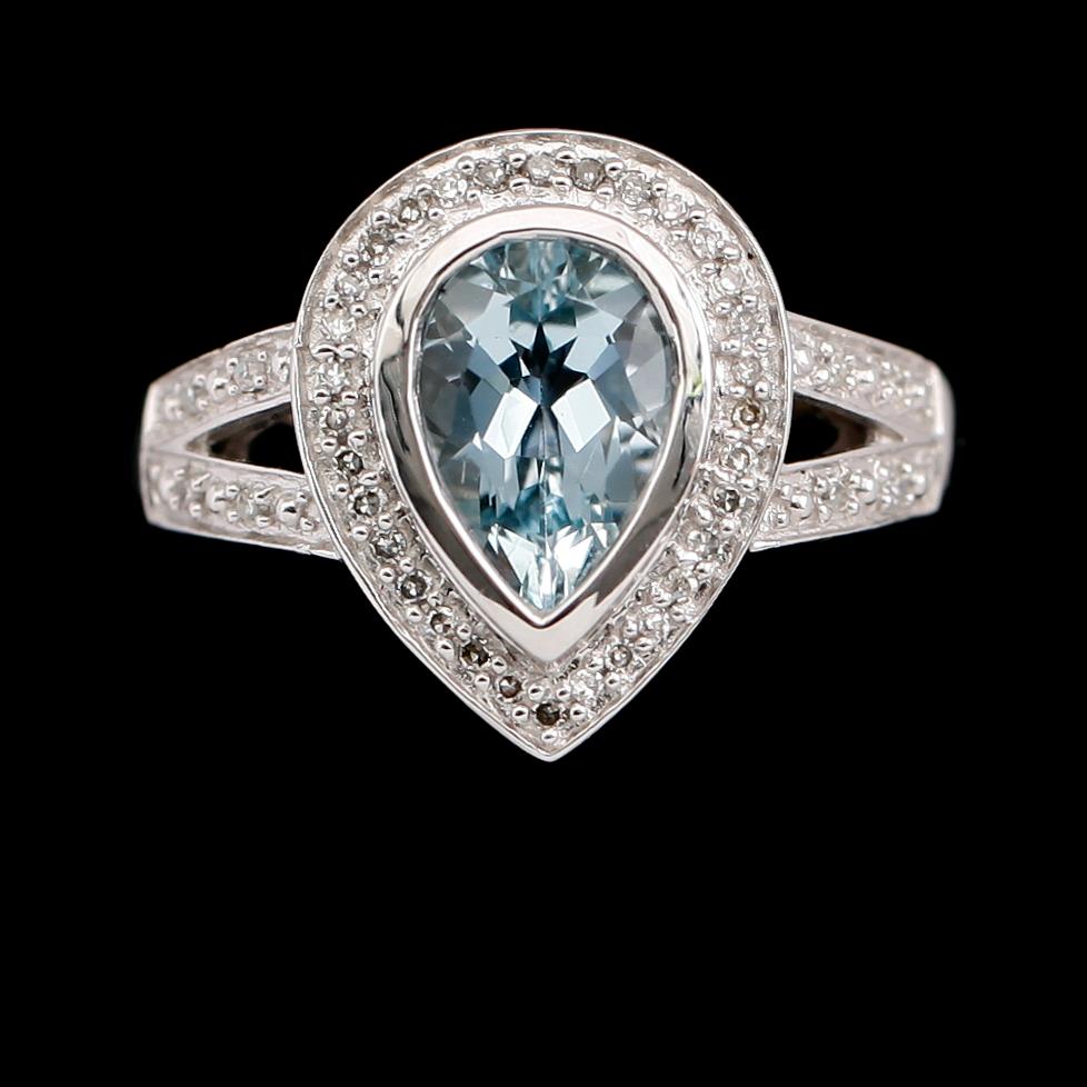 RING, 14 k vitguld, blå topas, diamanter tot 0.12 ct.