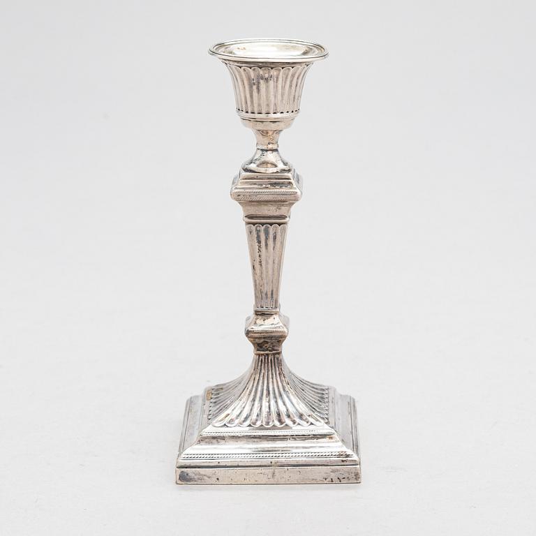 A late 19th-century sterling silver candlestick, maker's mark of William Hutton & Sons, London 1893.